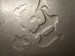 Water drops on a metal surface.