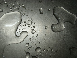 Water drops on a metal surface.