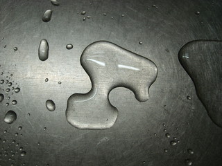 Water drops on a metal surface.
