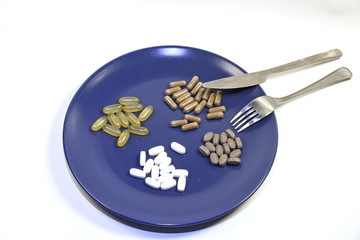 photo of a plate with vitamin supplements