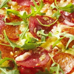 Closeup Rucola Salami Pizza