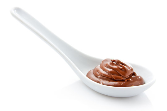 Chocolate cream in a white spoon