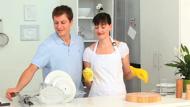 Couple washing up together