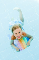 Fototapeta na wymiar Little girl swimming