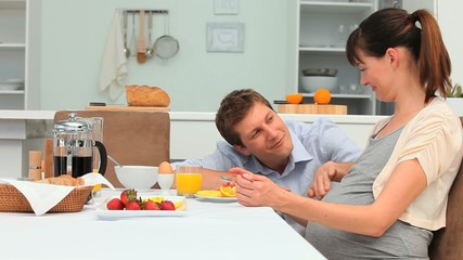 Young lovely couple taking the breakfast - Powered by Adobe