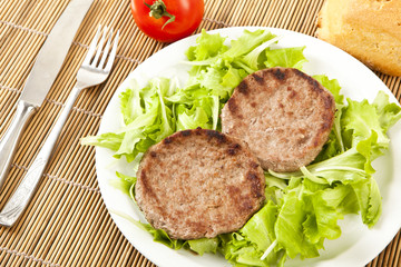 two hamburger on green lettuce