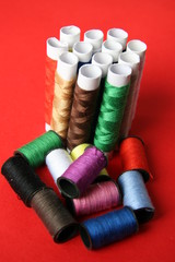 Threads on a red background