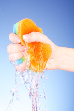 Squeezing Sponge On Background