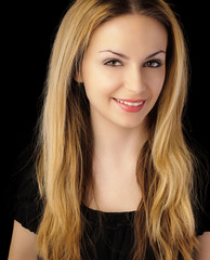 Naklejka premium Beautiful woman with long blond hair smiling