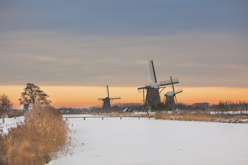 windmills in Kinderdijk at winter sunset
