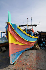 Obraz premium Luzzu, Maltese typical fishing boat on Marsaxlokk harbour, Malta