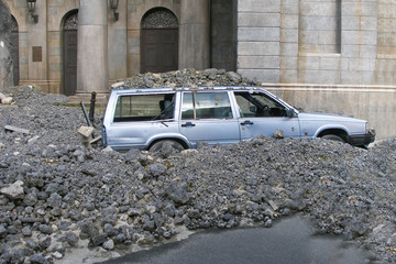 car under stones