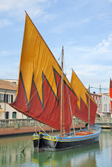 Italy Cesenatico harbor, antique fishing sailing boat