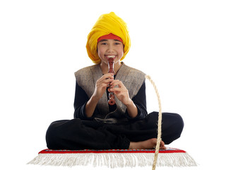 boy playing the flute charming a rope