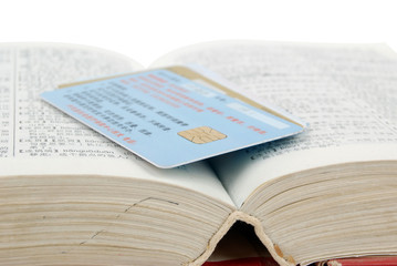 Obraz premium Dictionary and credit card