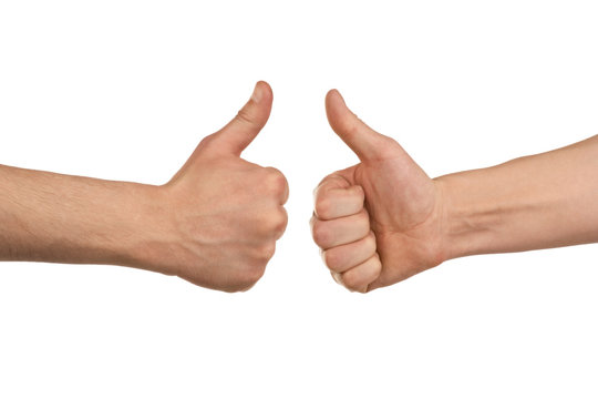Two male hands showing thumbs up