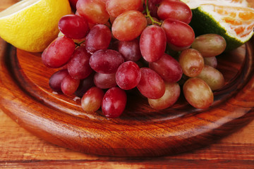 fruits on wooden plate