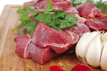 beef meat fillet on a wooden plate with dill