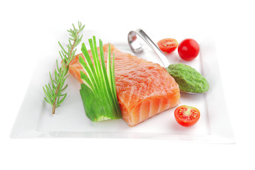 salmon fillet with vegetables and pesto sauce