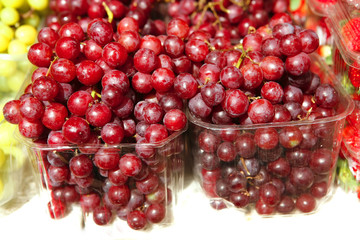 lot of red and green grapes on counter