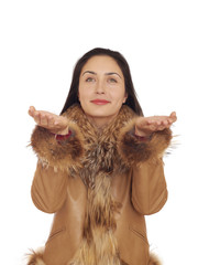 Pretty young brunette woman stretching her hands to up