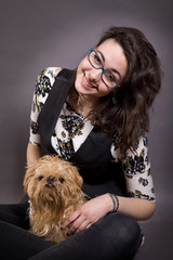 Young beautiful girl with a small dog