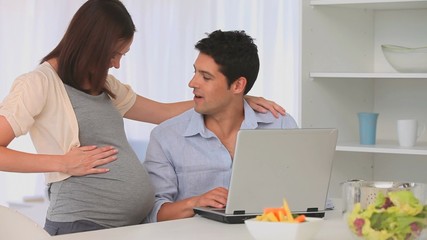 Man listening to his future baby - Powered by Adobe