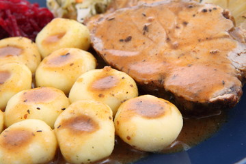 Pork steak and dumplings with side salads