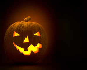 Halloween pumpkin glowing in the dark
