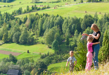 Family resting in a mountain walk