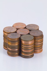 Seven piles of cent coins arranged in a circle