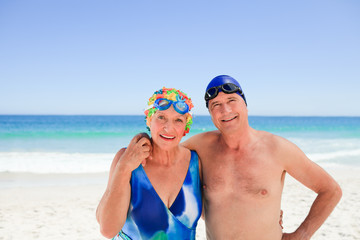 Happy elderly couple on the beach