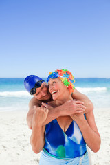 Happy elderly couple on the beach