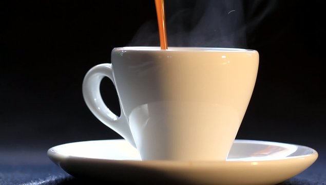Pouring coffee in a cup