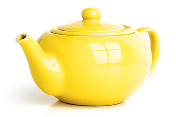 Yellow teapot isolated on white.