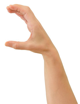 Hand of a caucasian female to grab some round object, isolated on white