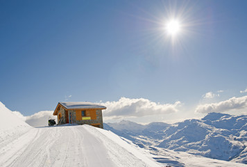 Isolated mountain hut in the sun