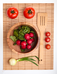 Different ripe vegetables compositions in studio on bamboo