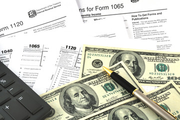 Tax Season. The Concept Image with a calculator, money and tax r