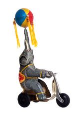 Vintage tin wind-up toy, elephant on tricycle with ball