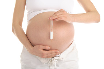 pregnant woman holding a test tube with sperm