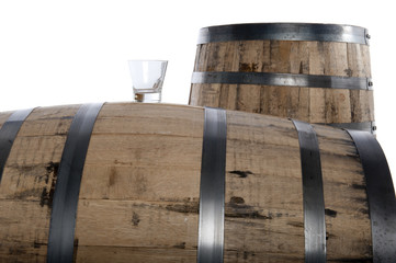 whiskey glass and barrels