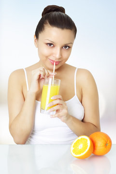 Girl with fresh orange juice