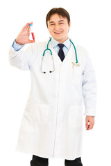 Pleased medical doctor holding blood sample in hand