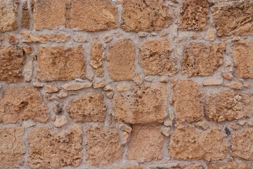 Ancient yellow stone wall texture