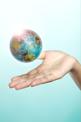 hand and globe