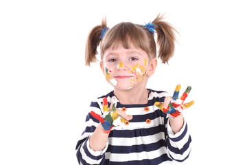 four-year girl with hands soiled in a paint.