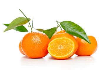 Tangerines with leaves isolated over white