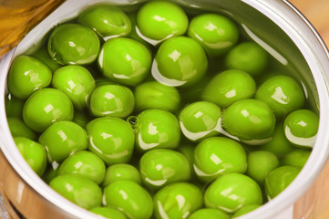 Tin can with green peas