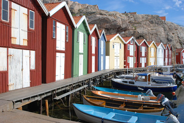 Fototapeta na wymiar Boats and boathouses in the swedish town Smögen